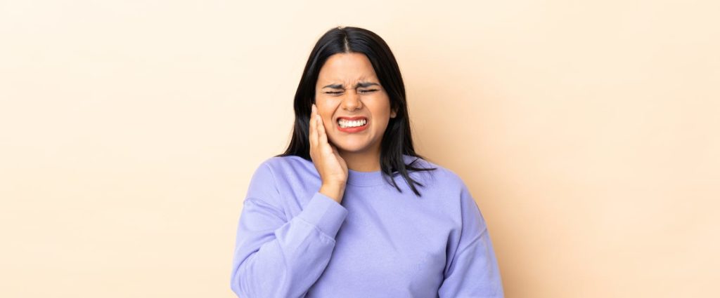 Bruxism: Teeth Grinding at Night A woman with jaw pain