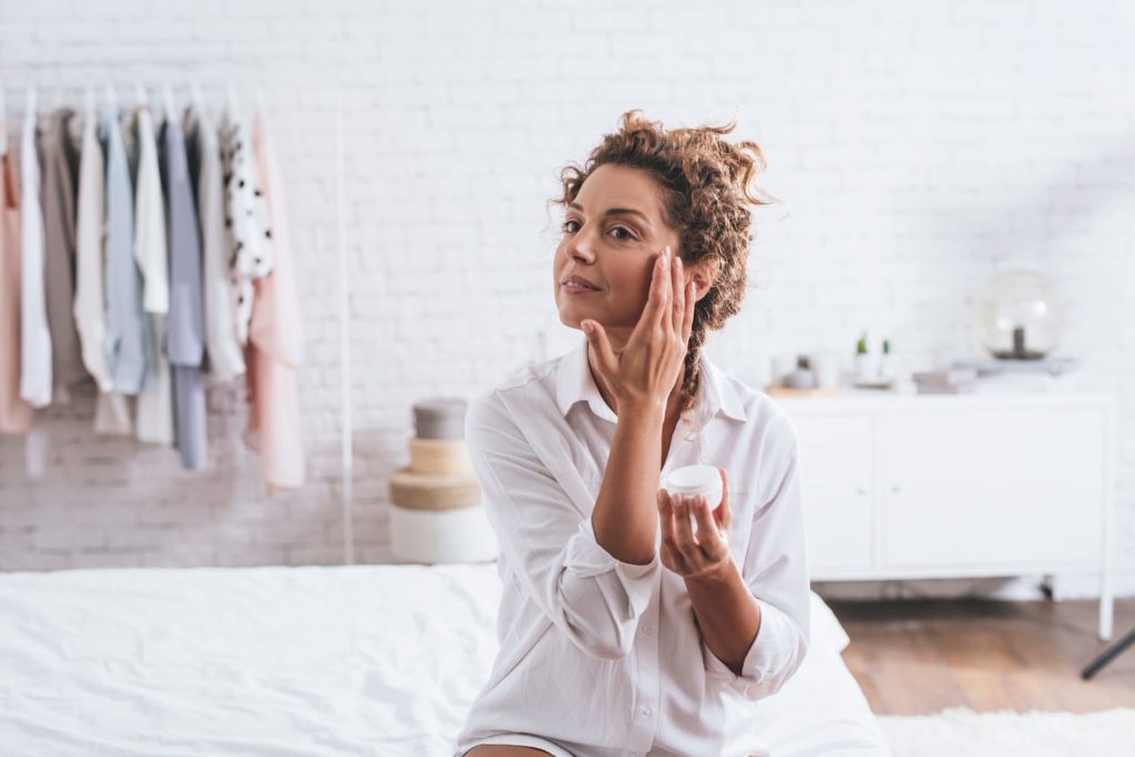 Bedtime Routines for Adults woman doing skin care routine