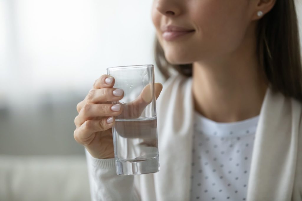 Drinking Water Before Bed Woman drinking water