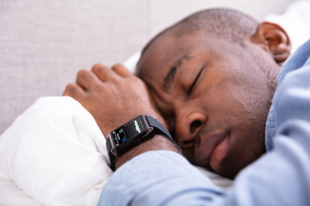 Actigraphy man with wristwatch sleeping
