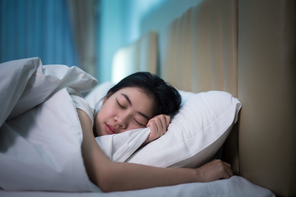 How Much Deep Sleep Do You Need? A woman in a deep sleep
